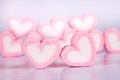 The marshmallow heart shape in cup on pink background with love concept Royalty Free Stock Photo