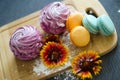 Marshmallow and macaroons with flowers and sprinkles