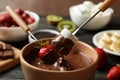 Marshmallow and strawberry in chocolate, close up. Royalty Free Stock Photo