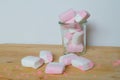 Marshmallows colorful white and pink in glass cup isolated on white background. Sweet candy dessert. Royalty Free Stock Photo