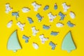 Marshmallows in the shape white and gray mice or rats and christmas trees on yellow background. Colorful mini Royalty Free Stock Photo