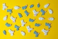 Marshmallows in the shape white and gray mice or rats on yellow background. Colorful mini marshmallows.Top view. 2020 Royalty Free Stock Photo