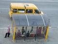 A 'marshrutka' routed taxi and bus stop with people