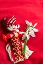 Martenitsa - traditional Bulgarian custom - red background with snowdrops Royalty Free Stock Photo