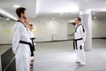 Martial art master lining up his taekwondo students Royalty Free Stock Photo