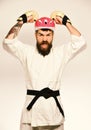 Martial arts. Man with beard in kimono and pink helmet Royalty Free Stock Photo