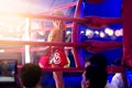 Martial arts of Muay Thai boxer kid with items in boxing ring coner