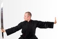 Martial arts teacher with sword up Royalty Free Stock Photo