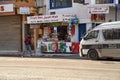 Martial Tunisian police car next to a small stall selling nuts, dried fruit and refreshments Royalty Free Stock Photo