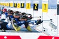 Martin Fourcade (FRA) and other on a firing line