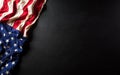 Martin Luther King Day anniversary concept. American flag against black wooden background Royalty Free Stock Photo