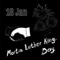 Martin Luther King Day on black background. Handshake with fire