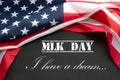 Martin Luther King Day. Flag of USA on black background with text.