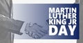 Martin Luther King jr day. White and black handshaking background