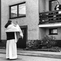 Priest with mask with eucharistic adoration on Easter sunday in village Martincek, Slovakia Royalty Free Stock Photo