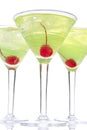 Martini alcohol cocktails in row yellow and green