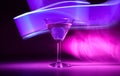 Martini cocktail drink in neon iridescent pink and blue colors. Royalty Free Stock Photo
