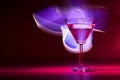 Martini cocktail drink in neon iridescent pink and blue colors. Royalty Free Stock Photo