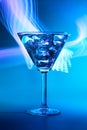 Martini cocktail drink in neon iridescent pink and blue colors. Royalty Free Stock Photo