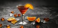 A martini cocktail with garnish on background of festive decorations and city lights,copy space Royalty Free Stock Photo