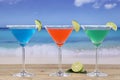 Martini Cocktails in glasses on the beach with lemons Royalty Free Stock Photo