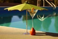 martini cocktails and pool toys arranged artfully