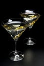 Martini drinks with olives isolated on black table Royalty Free Stock Photo