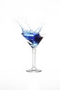 Martini glass with blue water splash in it isolated on white background Royalty Free Stock Photo