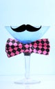 Martini glass with bow tie and mustache - vertical.