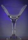 Martini Glass with dark violet lights on background