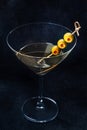 Martini. A glass of dirty martini cocktail with vermouth and olives Royalty Free Stock Photo