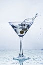 Martini glass with frozen splashing drops of drink Royalty Free Stock Photo