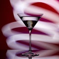 Martini glass on a red background with white lights Royalty Free Stock Photo