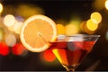 Martini in glass with slice of orange on dark Royalty Free Stock Photo