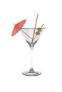 A martini glass with a straw, parasol and olives isolated on a white background Royalty Free Stock Photo