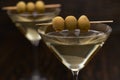 Martini in glasses, close up.Classic dry Martini with  green olives Royalty Free Stock Photo