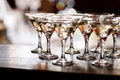 martini glasses in front of gold bokeh background. Luxury cocktail drink in restaurant bar with night lights blur Royalty Free Stock Photo