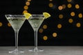 Martini glasses of refreshing cocktails with lemon slices on light grey table, space for text Royalty Free Stock Photo