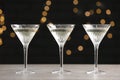 Martini glasses of refreshing cocktails on light grey table Royalty Free Stock Photo
