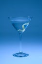 Martini with lemon twist shifted blue Royalty Free Stock Photo