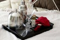 Martini shaker on tray laying on bed Royalty Free Stock Photo