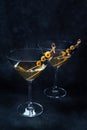 Martini. Two glasses of dirty martini cocktails with vermouth and olives Royalty Free Stock Photo