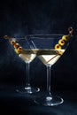 Martini. Two glasses of dirty martini cocktails with vermouth and olives Royalty Free Stock Photo