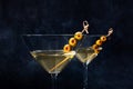 Martini. Two glasses of dirty martini cocktails with vermouth and olives Royalty Free Stock Photo