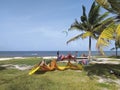 Kitesurfers with their equipments on a beautiful tropical beach. Practice of kitsurf in Caribbean Royalty Free Stock Photo