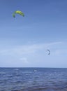 Kitesurfing on the waves of the Caribbean sea. Kitsurf practice in tropical waters. Top destination for surfers and kitesurfers. W