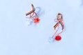 Martisor with romanian tricolor elements on snow texture background. Moldavian and Romanian spring symbol. Martisor is a red and Royalty Free Stock Photo