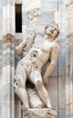 Martyrdom of Saint Erasmus, statue on the Milan Cathedral, Duomo di Santa Maria Nascente, Milan, Italy Royalty Free Stock Photo