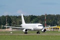 Marupe, Latvia - August 4, 2023 - a white passenger plane without identification marks or inscriptions is about to take off at the