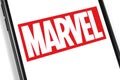 Marvel logo on the screen smartphone Royalty Free Stock Photo